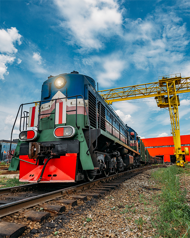 train on railway with gantry